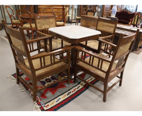 A square Art Nouveau coffee table with four matching chairs, early 20th century. Walnut, white marble top, carved decor of le