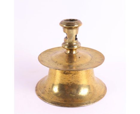 A brass candlestick, Capstan type, North West Europe, 2nd half 16th century. The slightly tapered candle mouth is pierced wit