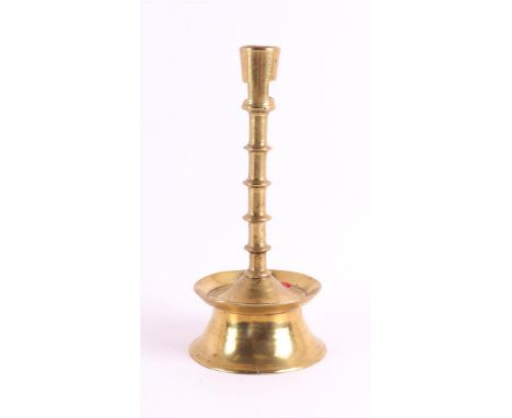 A brass button candlestick, Southern Netherlands, 2nd half 15th century. The conical candle mouth with two rectangular openin