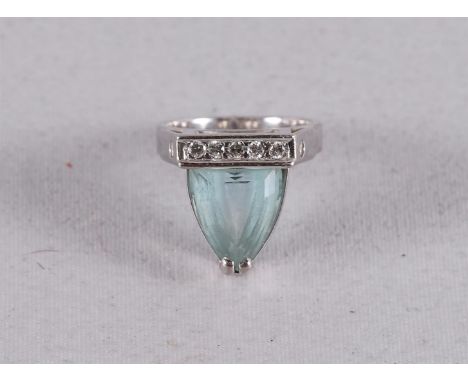 A 14 kt 585/1000 white gold design ring, set with aquamarine and five diamonds, design: Marion Pannekoek, gross weight 8.3 gr