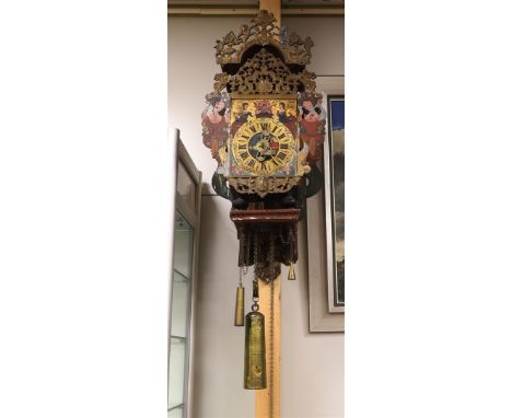 A chair clock, Friesland, 19th century. Polychrome decorated wooden chair. The hood and the attic lead with medallion, style 