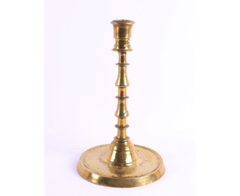 A brass/bronze button candlestick, Southern Netherlands (Flanders), 1st half 16th century. The candle mouth with collar and t