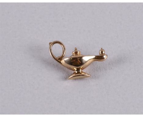 A 9 kt BWG pendant in the shape of an oil lamp.