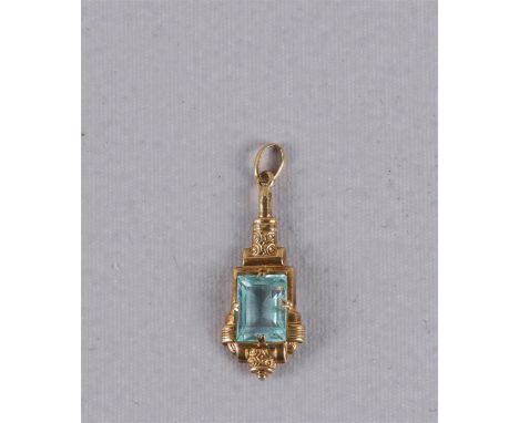 An 18 carat 750/1000 gold Art Deco pendant with a facet cut light green stone.