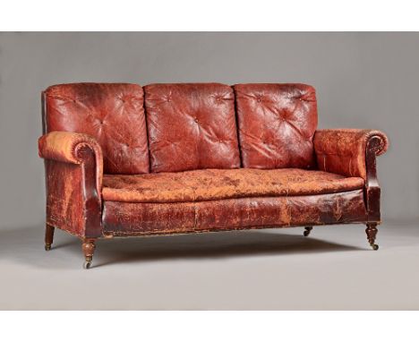 An early 20th century French rouge leather upholstered three seater sofa, on turned mahogany supports, 198cm wide x 97cm high