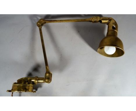 A Vintage style brass wall mounted anglepoise lamp. 