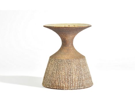 Waistel Cooper ( 1921-2003), a stoneware vase or lamp base, the sides incised with vertical lines beneath a waisted neck and 