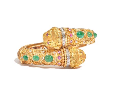 An emerald, ruby and diamond hinged bangle by Ilias Lalaounis, the hinged open work bangle of crossover design, each end mode