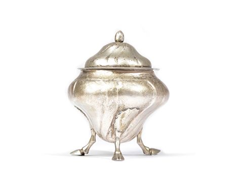 A foreign tea caddy, with a detachable cover, having widely fluted decoration, raised on three hoof shaped feet, the cover wi