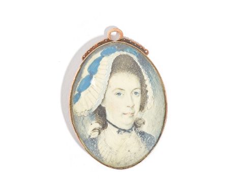 An oval portrait miniature of a lady wearing a bonnet, in an oval pendant mount as converted from a clasp, the back with engr