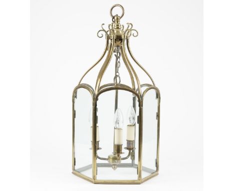 A Victorian style brass hall lantern of hexagonal form with an internal three light fitment, 56cm high. 