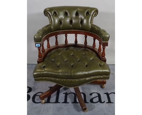 A 20th century hardwood framed office open armchair with button back green leather upholstery, 61cm wide x 82cm high. 