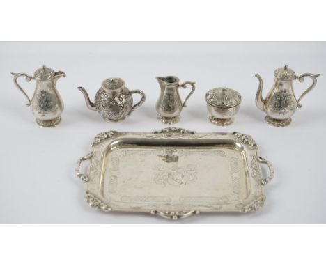 A miniature tea/coffee set, comprising; a shaped rectangular twin handled tray, a coffee pot, a hot water jug, a sugar bowl a