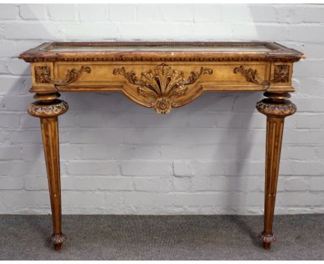 A Louis XVI style gilt framed console table with mirrored top over carved frieze on tapering fluted supports, 101cm wide x 83