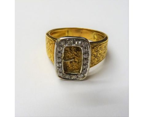 A gold and diamond set ring, with a buckle motif, mounted with circular cut diamonds, otherwise with engraved decoration, det