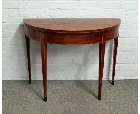 A George III inlaid mahogany semi-elliptic card table, on tapering square supports, 97cm wide x 75cm high.