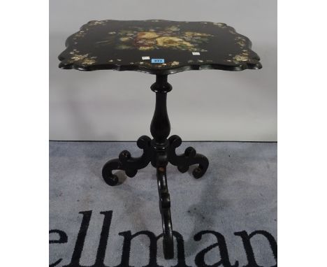 A Victorian ebonised and mother of pearl inlaid tripod table on three downswept supports, 56cm wide x 72cm high. 