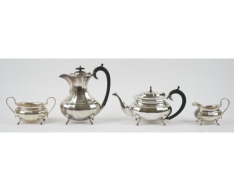 A silver four piece tea set, comprising; a teapot, a hot water jug, a twin handled sugar bowl and a milk jug, each piece of p