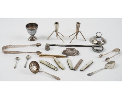 Silver and silver mounted wares, comprising; two pairs of sugar tongs, a sugar sifting spoon, a preserve spoon, two condiment