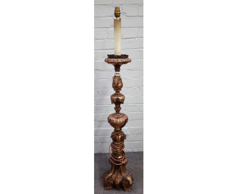 An 18th century Italian polychrome painted altar candlestick, 95cm high, excluding fittings.