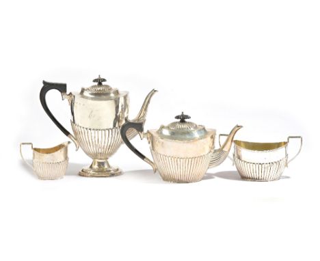 A silver four piece tea and coffee set, comprising; a teapot, a coffee pot, a twin handled sugar bowl and a milk jug, each pi