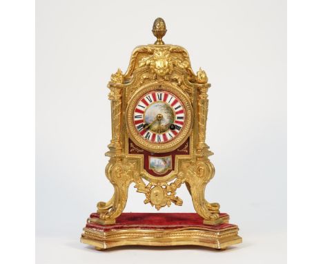 A French Louis XVI style gilt metal and porcelain mounted mantel clock, early 20th century, with two train movement, countwhe