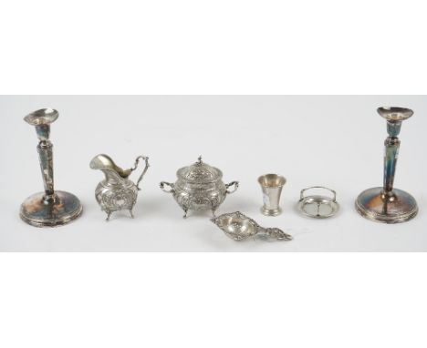 A group of Swedish silver, comprising; a pair of candlesticks, each with an octagonal tapered stem, raised on a circular foot