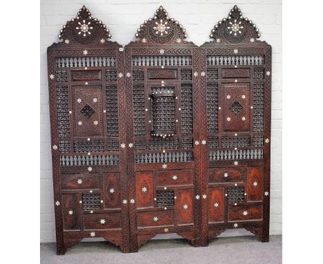 An early 20th century North African mother-of-pearl inlaid hardwood three fold screen, with bobbin turned decoration, 180cm w