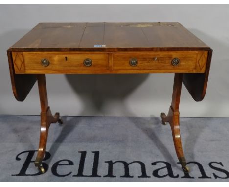 A Regency rosewood sofa table, with two real and two opposing drawers, on rectangular section end supports, 154cm wide open x