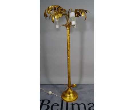 A 20th century gold painted metal standard lamp, the three glass shades with leaf decoration, 164cm high. 