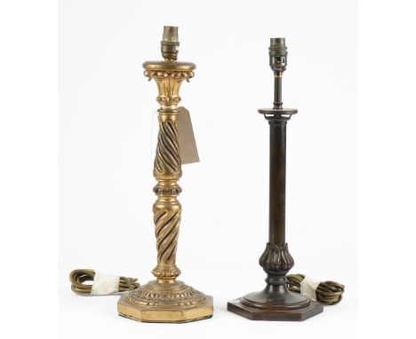 A Victorian style giltwood table lamp, the carved column on an octagonal foot, 42cm high and a patinated bronze table lamp, a