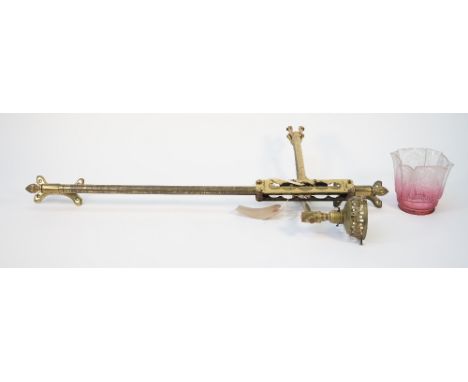 Curry &amp; Paxton; a gilt brass wall light with adjustable arm and etched ruby glass shade, 83cm high.