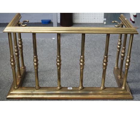 A Victorian gilt brass fire fender, with stepped top and kerb, united by turned pillars andwith internal tool supports, 91cm 
