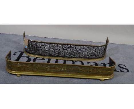 A late Victorian brass fender with pierced foliate decoration, 100cm wide and another similar on bun feet, 103cm wide, (2). 