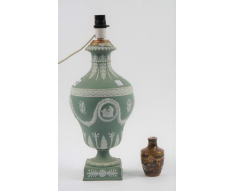 A Wedgwood green jasper vase, late 19th/20th century, the pear shaped body sprigged in white with panels of classical figures