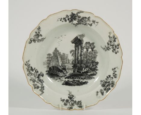 A Worcester porcelain deep plate, circa 1770, transfer printed in black with St Paul's Gate and the Temple of Jupiter, the bo
