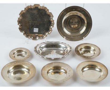 Six silver Armada style dishes in varying sizes, a shaped oval trinket dish and a shaped circular card tray, mostly presentat