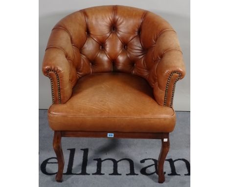 A 19th century French tub chair with brown button back leather upholstery, 68cm wide x 80cm high. 