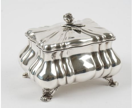 An Austro-Hungarian tea caddy, of rectangular bombe form, with fluted decoration, raised on four feet, the hinged lid with a 