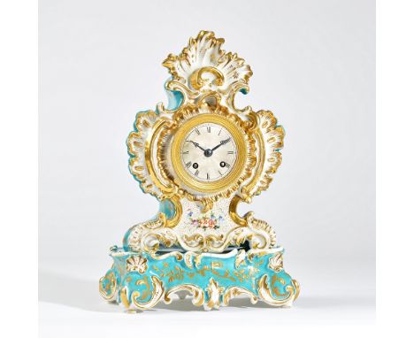 A Paris porcelain mantel clockPossibly Jacob Petit, circa 1850 of shaped outline with parcel-gilt decoration on a torquoise g