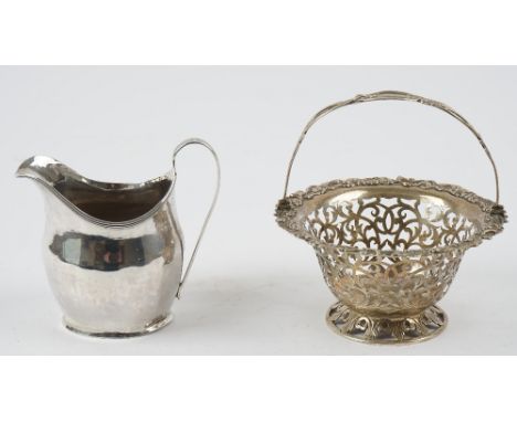 A George III silver helmet shaped cream jug, London 1803 and a Victorian silver basket, of shaped circular form, with pierced