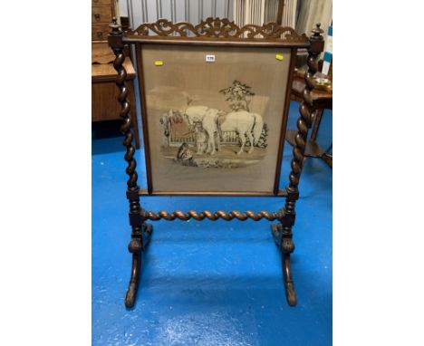 Mahogany carved twist firescreen with tapestry scene of horses and dogs, 30” wide x 46” high.