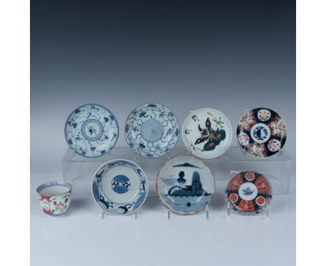 Lovely set that features eight hand painted pieces, including plates adorned with traditional Asian scroll patterns and a mat