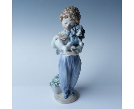 This Lladro porcelain figurine, titled My Buddy (1007609). Standing at 8" high, the piece is a charming representation of fri
