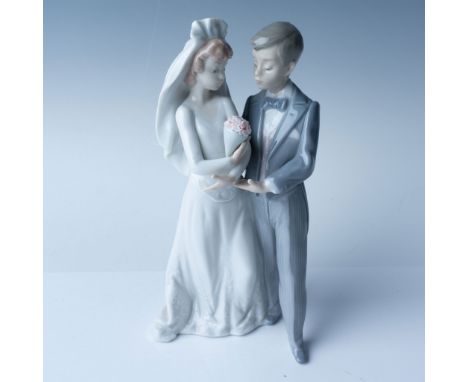 This Lladro porcelain figurine, titled "From This Day Forward," features a couple standing together in a romantic pose, symbo
