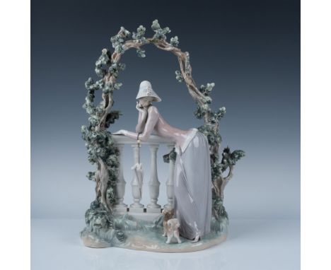 Beautiful glossy porcelain scene, depicting an elegant lady leaning on a balustrade in a garden with her little dog. Lladro b