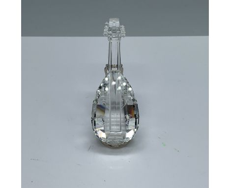 This elegant Swarovski crystal mandolin figurine is a testament to the brand's masterful craftsmanship and timeless design. T