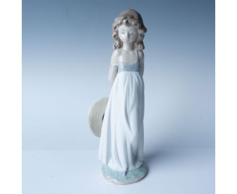 This single Lladro porcelain figurine, titled "Natural Beauty" measures 8.5"H and captures an elegant young girl in a flowing