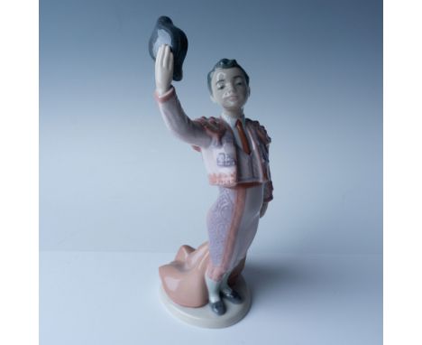 Lladro porcelain figurine titled "Little Matador" (No. 1006178) stands at 9.5"H and showcases a charming matador raising his 
