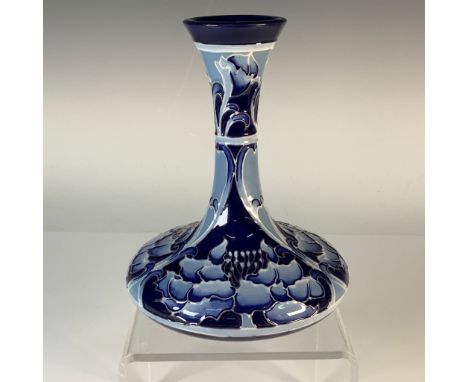 This Moorcroft Florian Ware vase showcases the iconic hand-painted floral motifs that define the Florian Ware series. Crafted